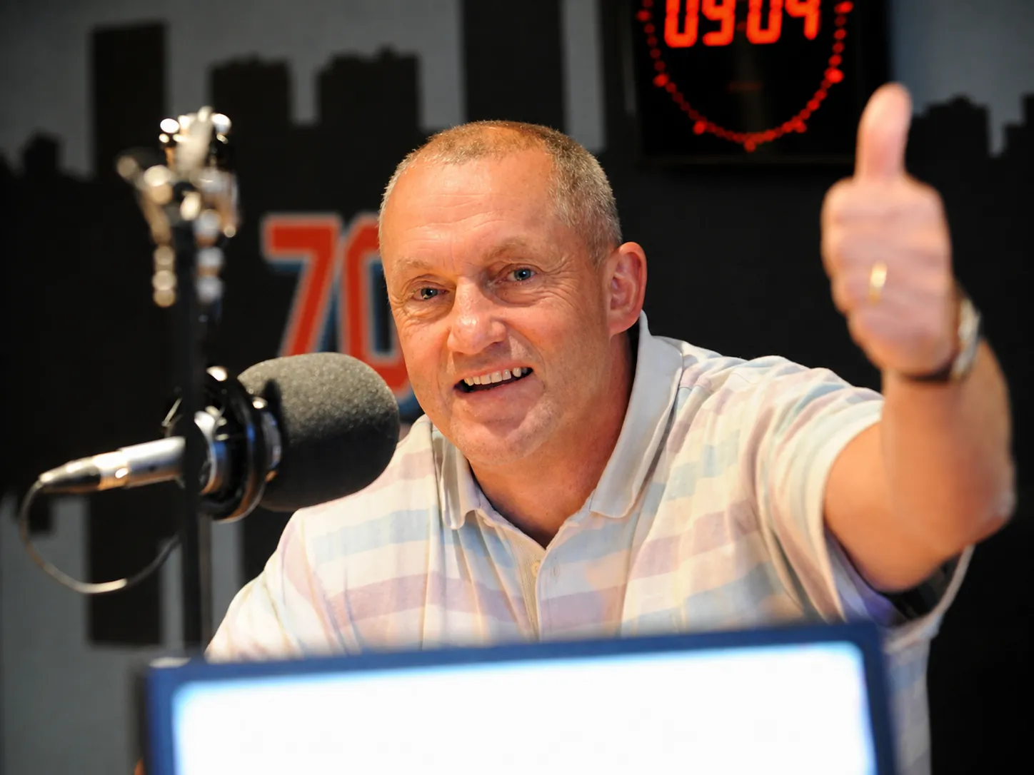 John Robbie broadcasting on radio